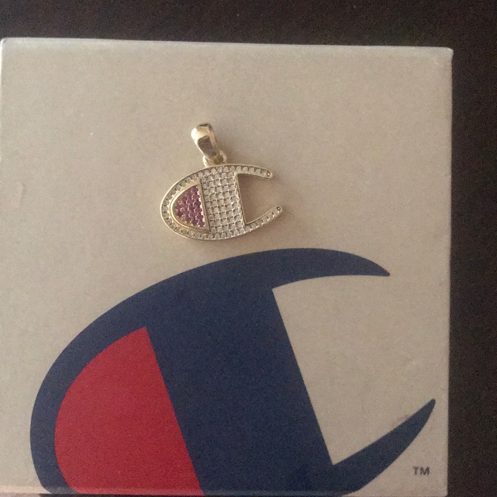 Champion gold pendant